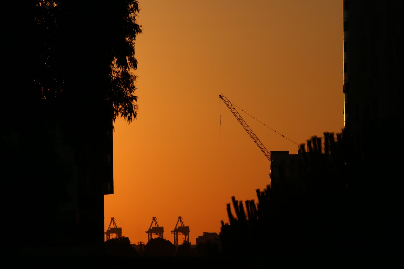 A deep orange sunset sky over Melbourne