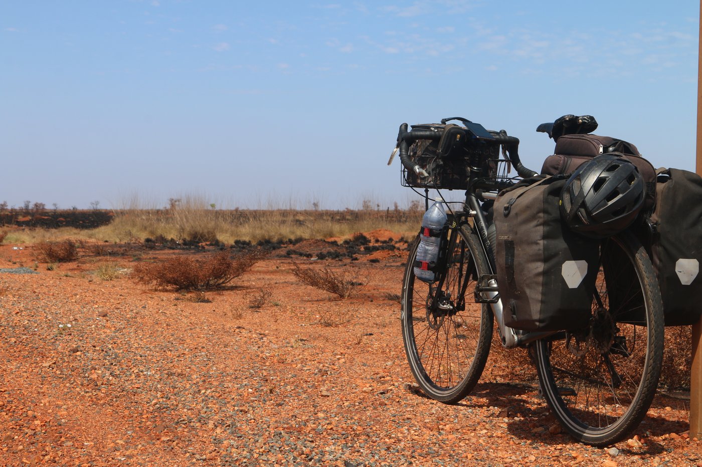 My bike standing at the edge of the road, which sometimes felt like the edge of the world, somewhere near Mundabullangana, Western Australia.