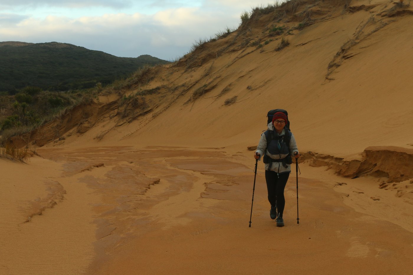 Rose walking up into the dunes beyond Herangi Hill.