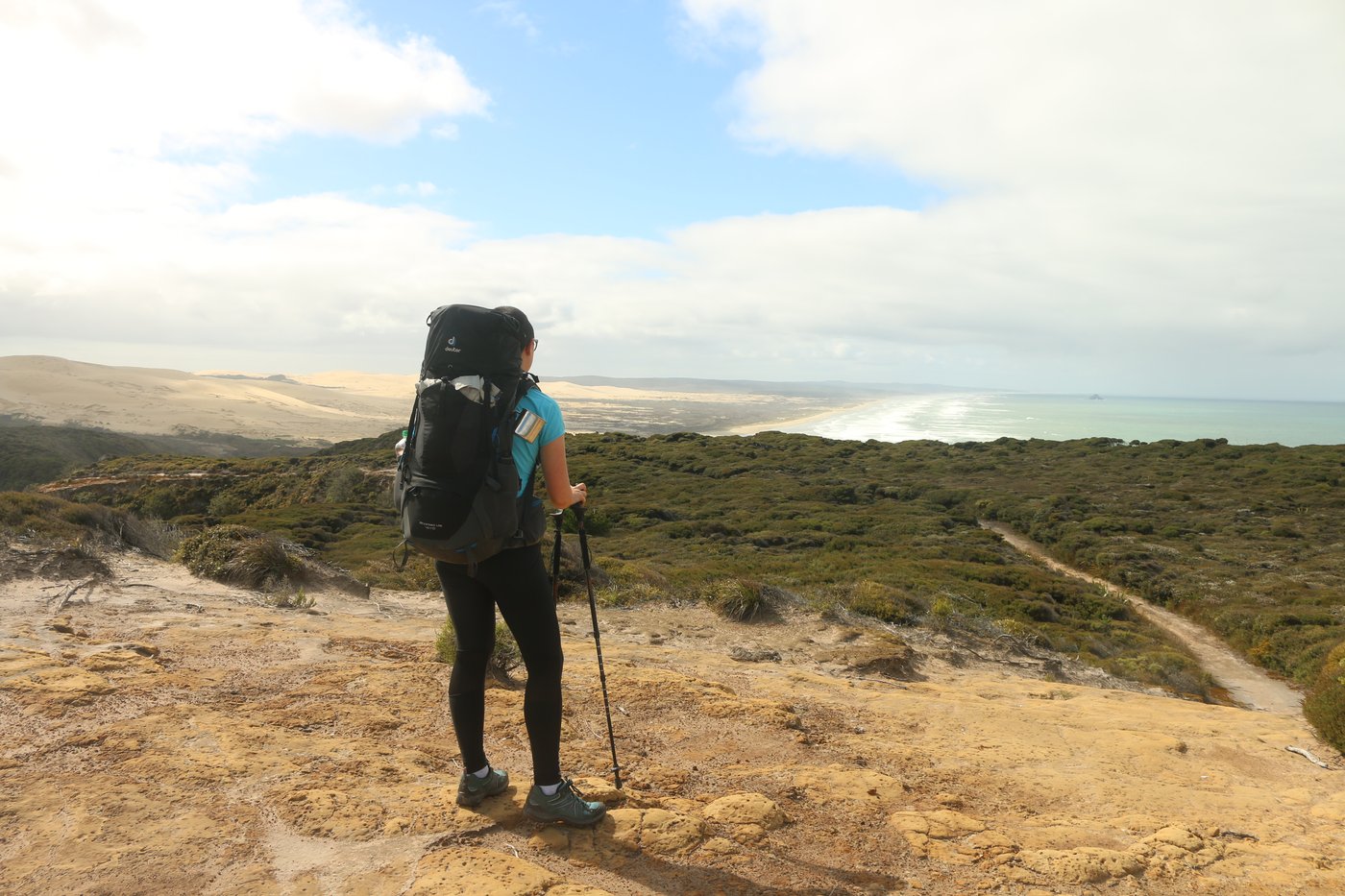 Rose looks out over Ninety Mile Beach from the Pukekarea headland.