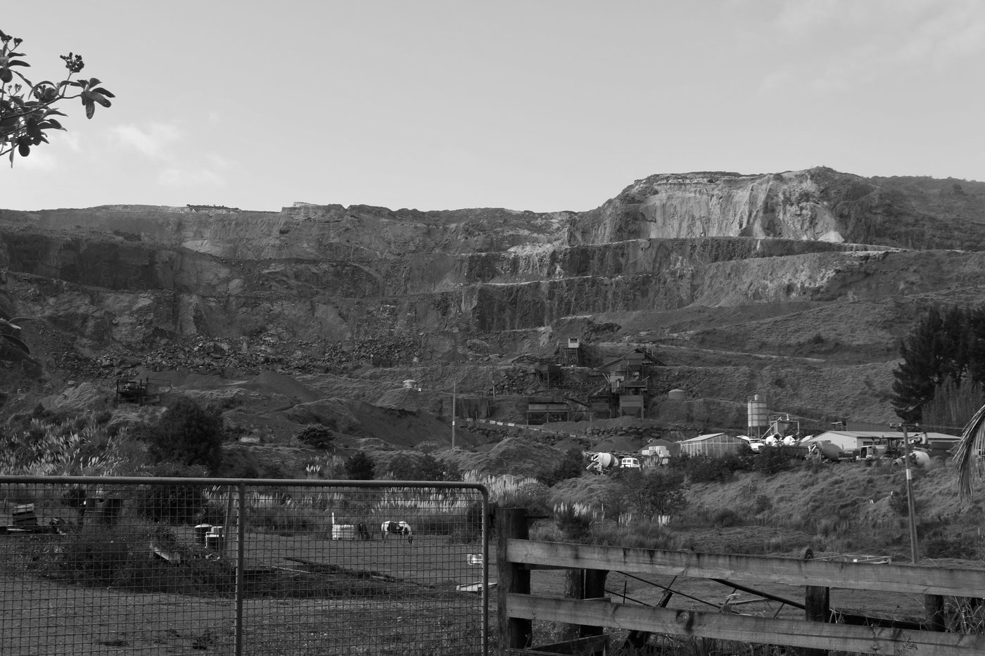 A hill, stepped and carved by quarrying.