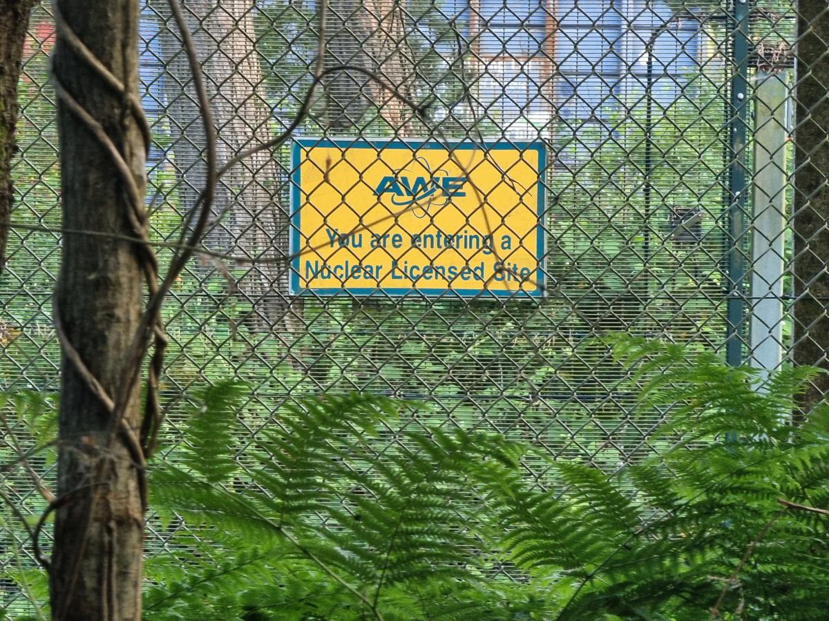A sign on a fence reads ‘You are entering a nuclear zone’