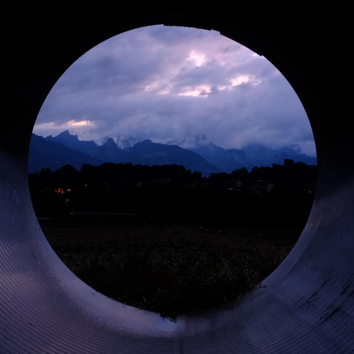 The morning view from inside a pipe I slept during heavy rain in Switzerland