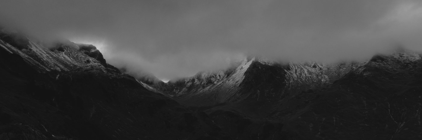 Low cloud over snowy peaks along the Via Alpina, western Austria.