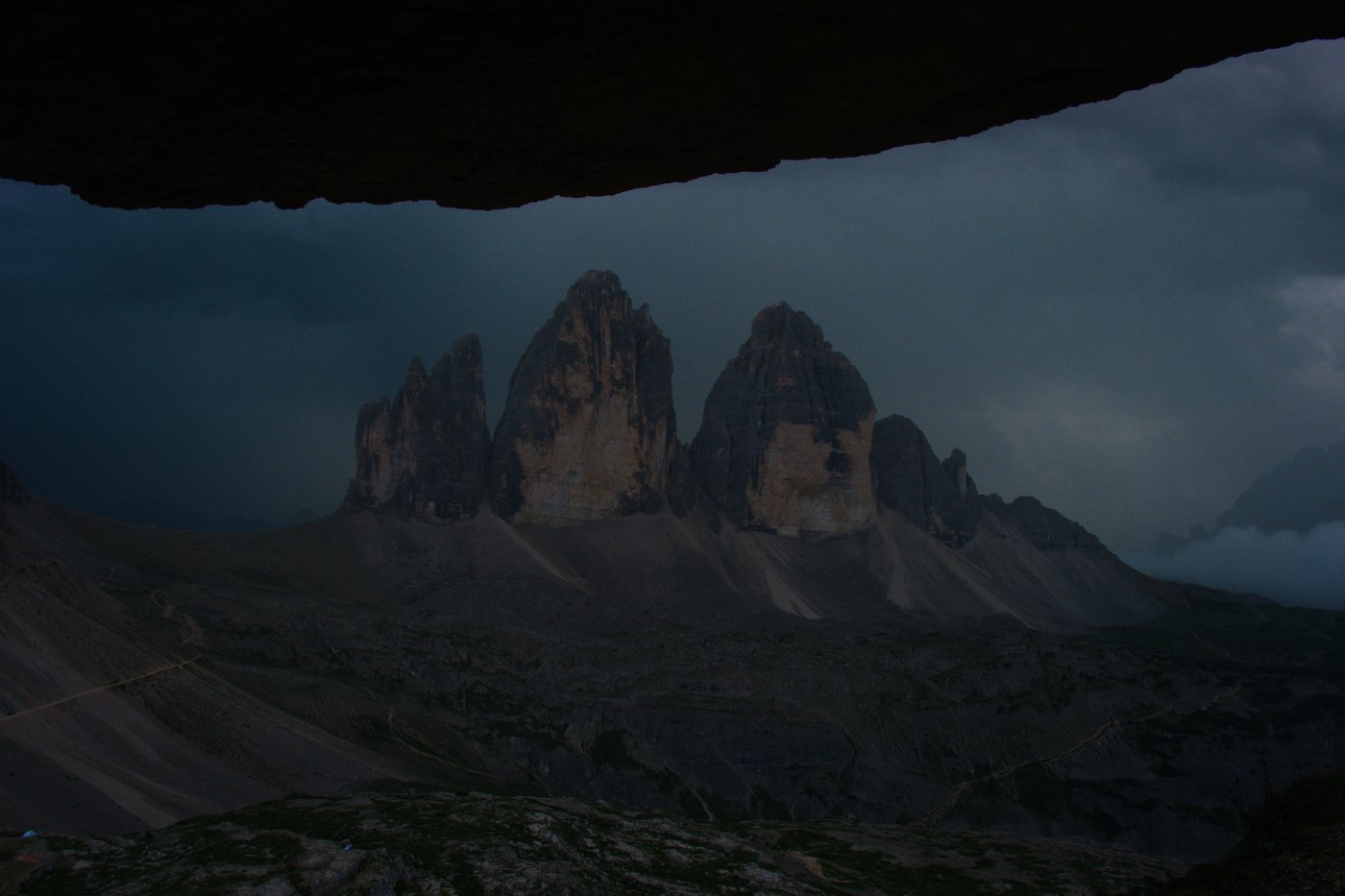 Looking across at Tre Cime do Lavaredo from a cave in Toblinger Knoten. Dolomites, Italy