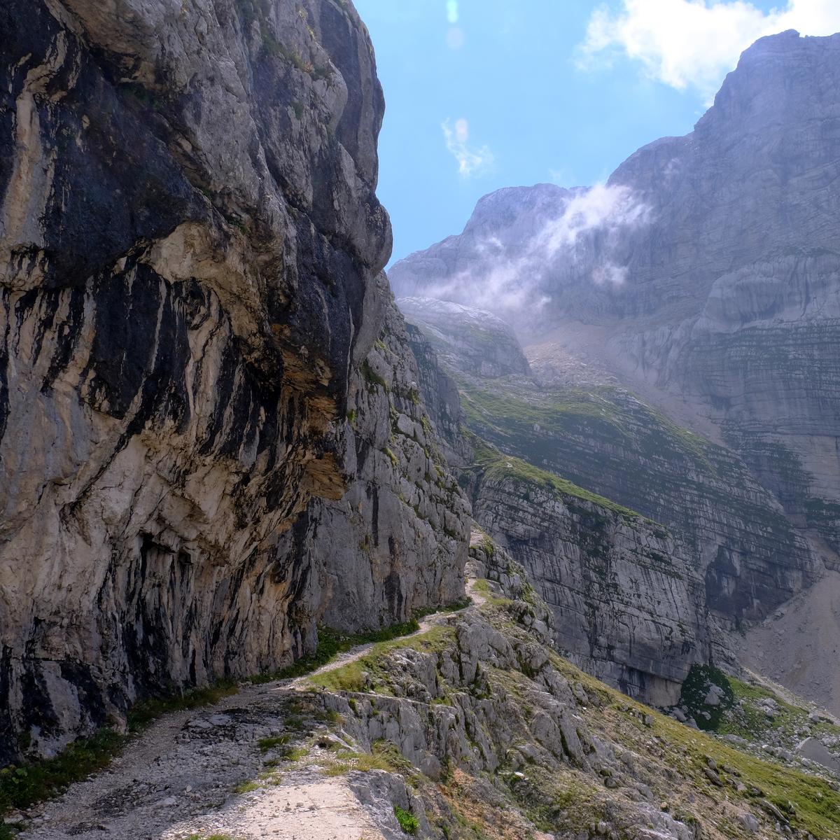 The route hugs the rock face on the way up to Sedlo Dolic, prior to the ascent of Mount Triglav, Slovenia