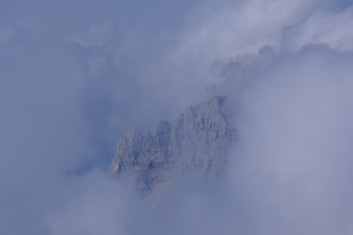 Stood atop Mount Triglav, cloud swallows up the surrounding peaks. Slovenia