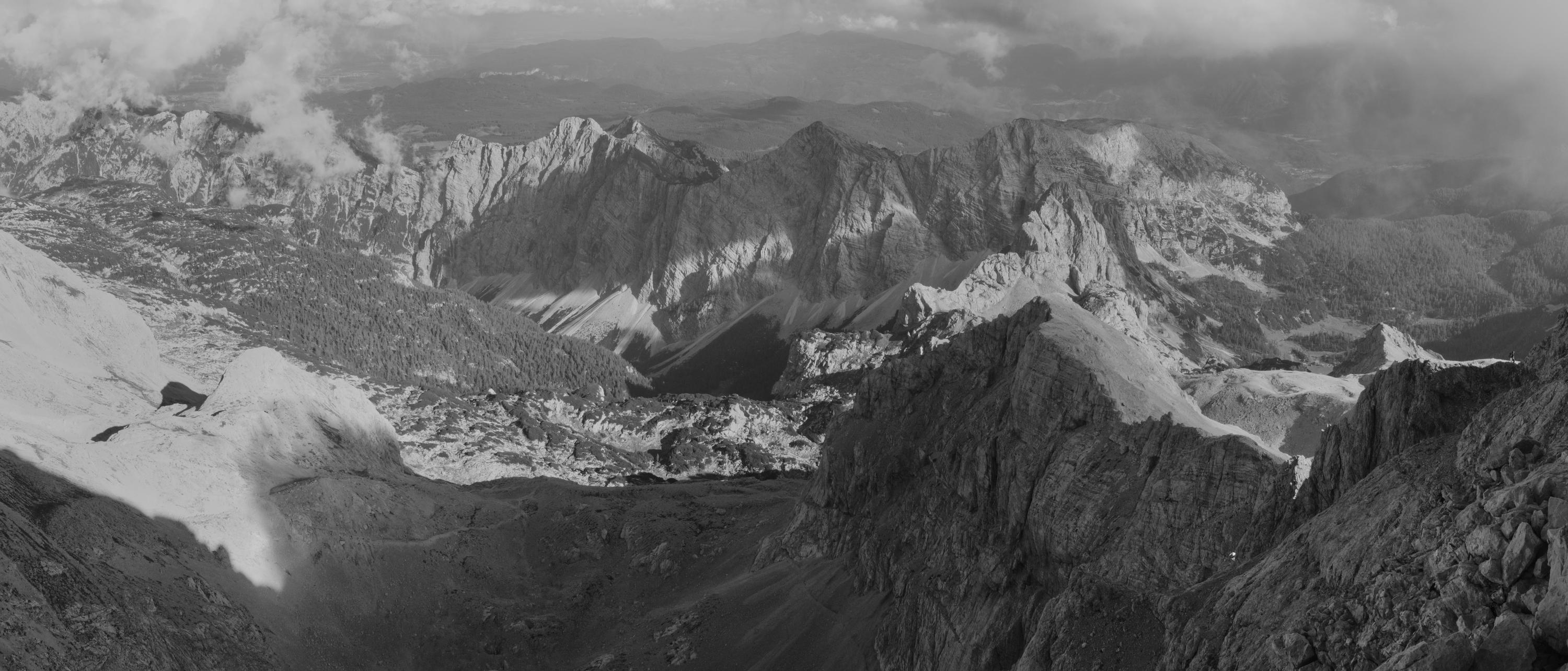 A panorama from the eastern ridge of Mount Triglav as the range falls into shade in the early evening. Slovenia