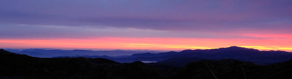 A view of the sunrise splitting the sky from our camp below the summit of Vileki Maglić, Montenegro