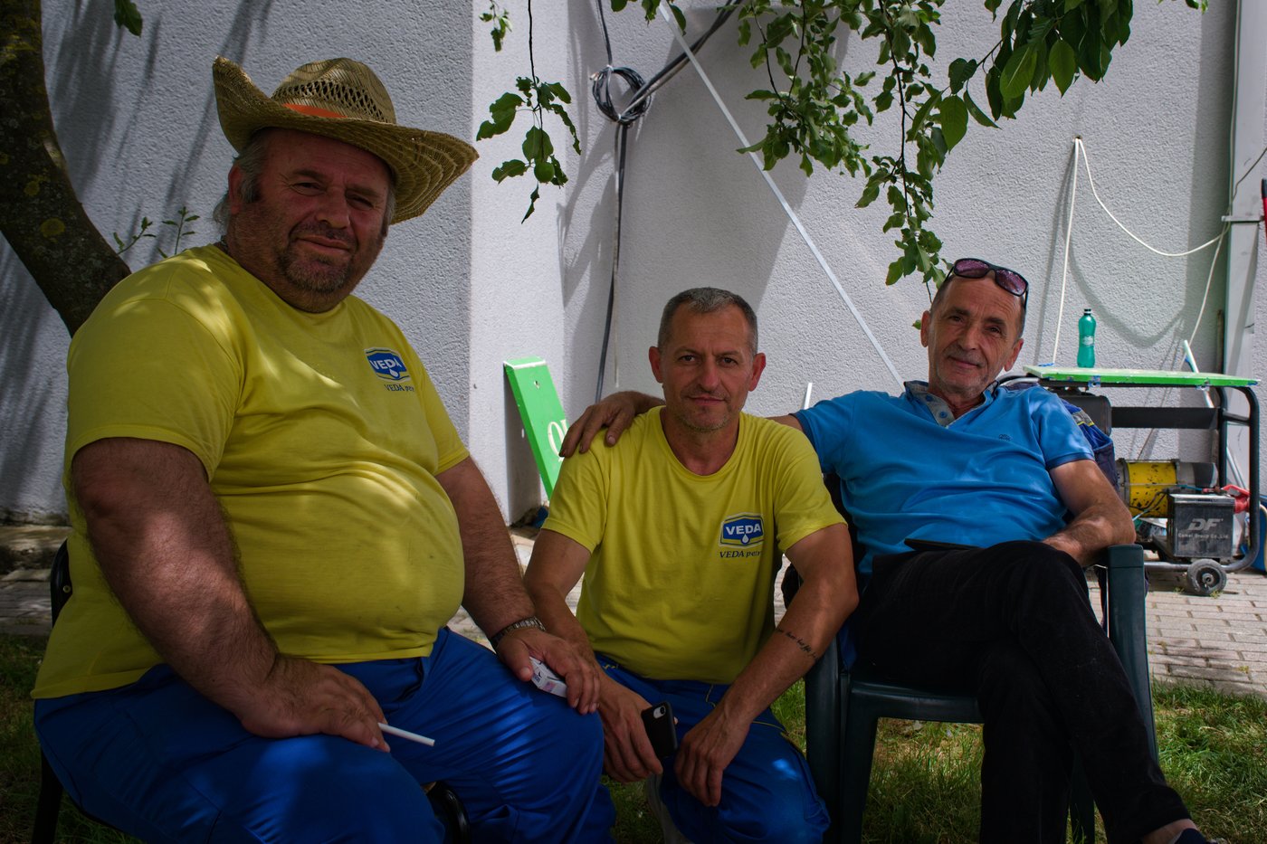 Prand, Wilson, and Gasper sit in the shade of a cherry tree outside Gasper’s gas station. Between Gjakovë and Prizren, Kosovo