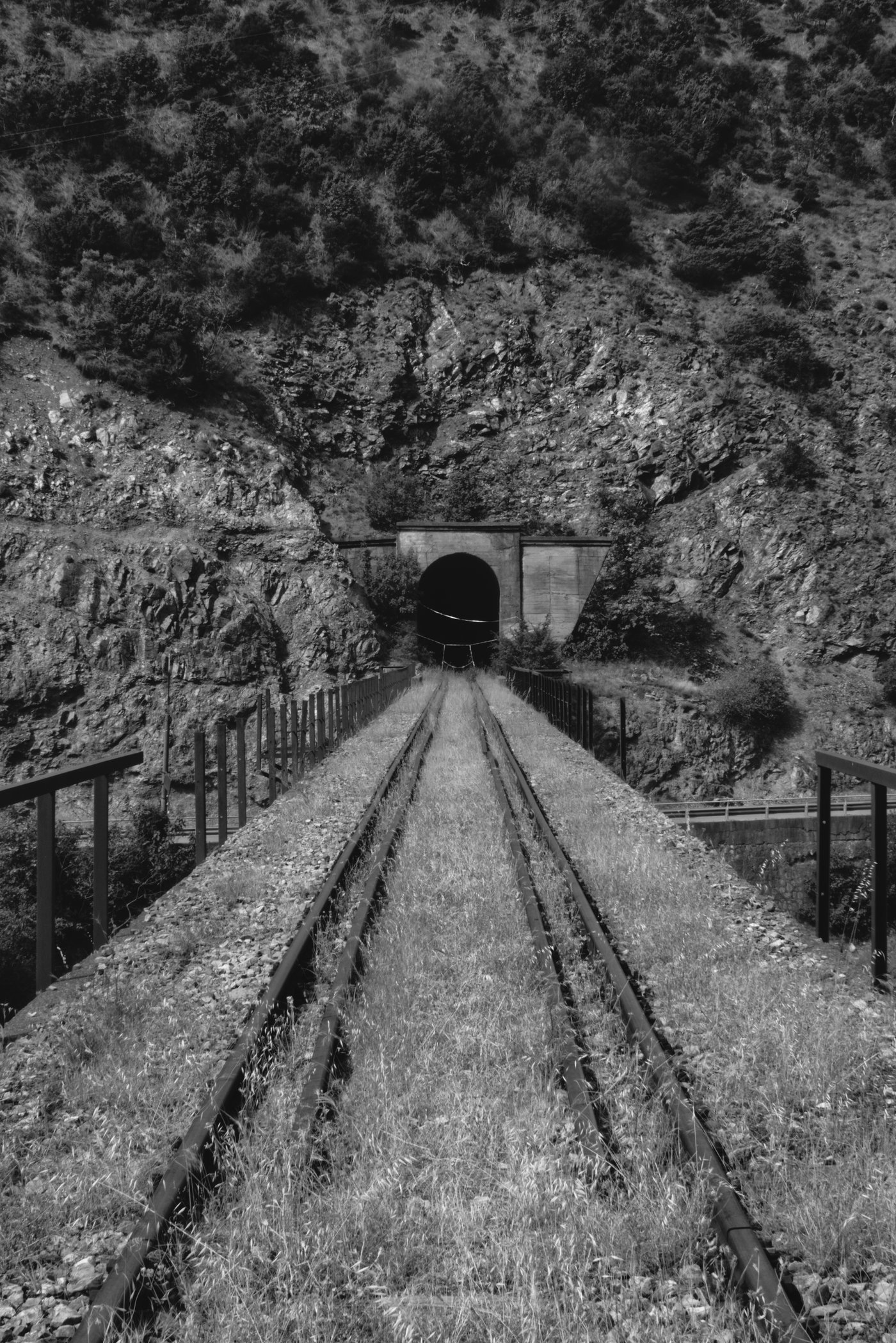 Following abandoned rail tracks into a kilometre long tunnel between Labrazhd and Peshkopi, Albania