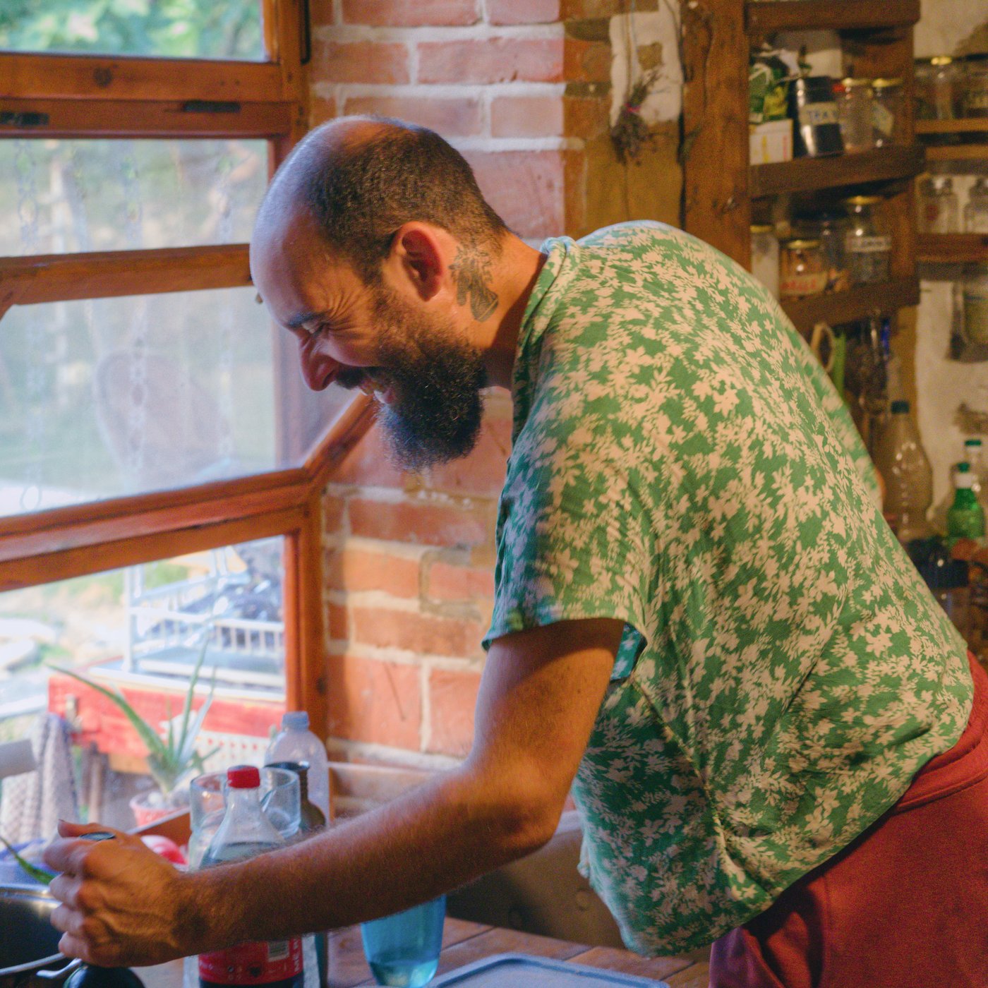 Atlas caught in the act (mixing a Fernet and coke) in the kitchen at the house in Pëllumbas, Albania