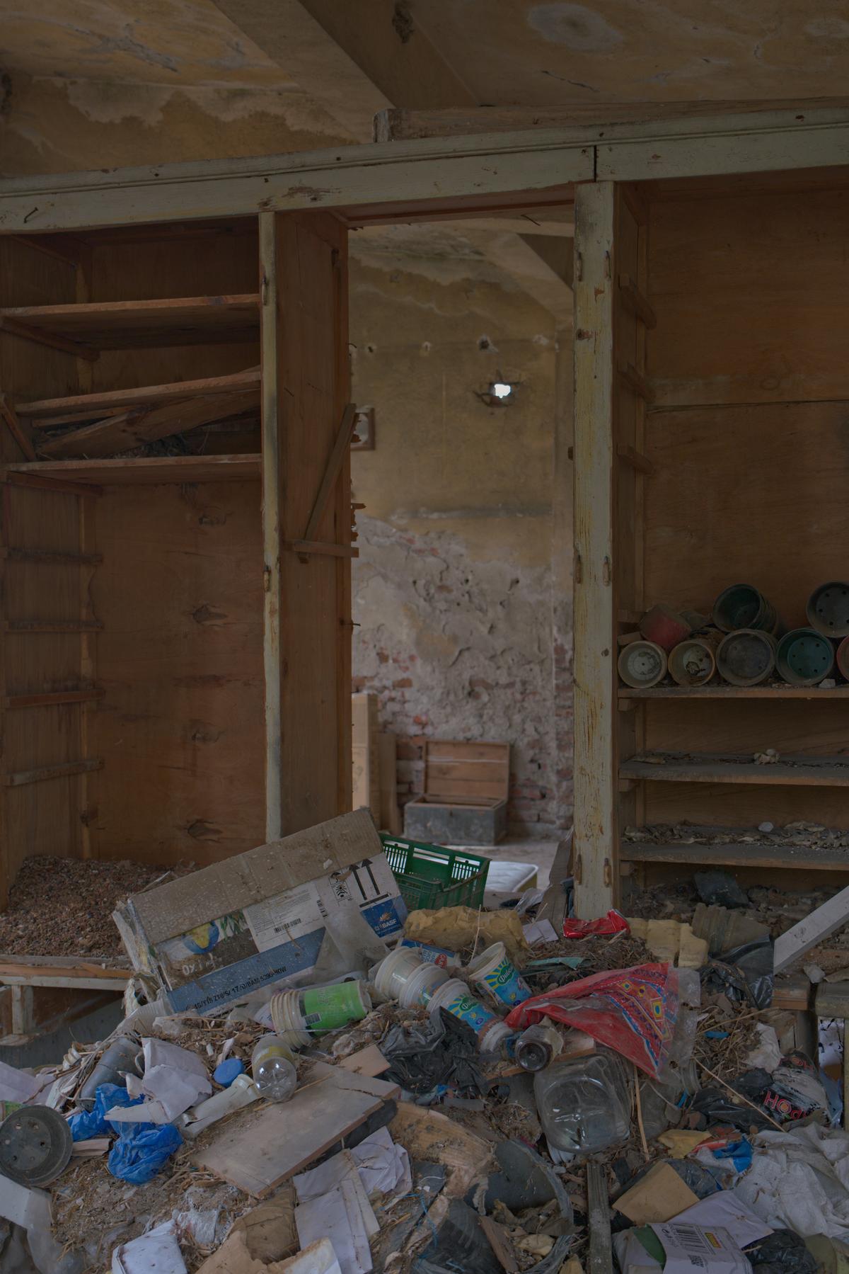 A mound of trash in a derelict shed. Not pictured, the dead animals and feces on the floor. Plovdiv, Bulgaria