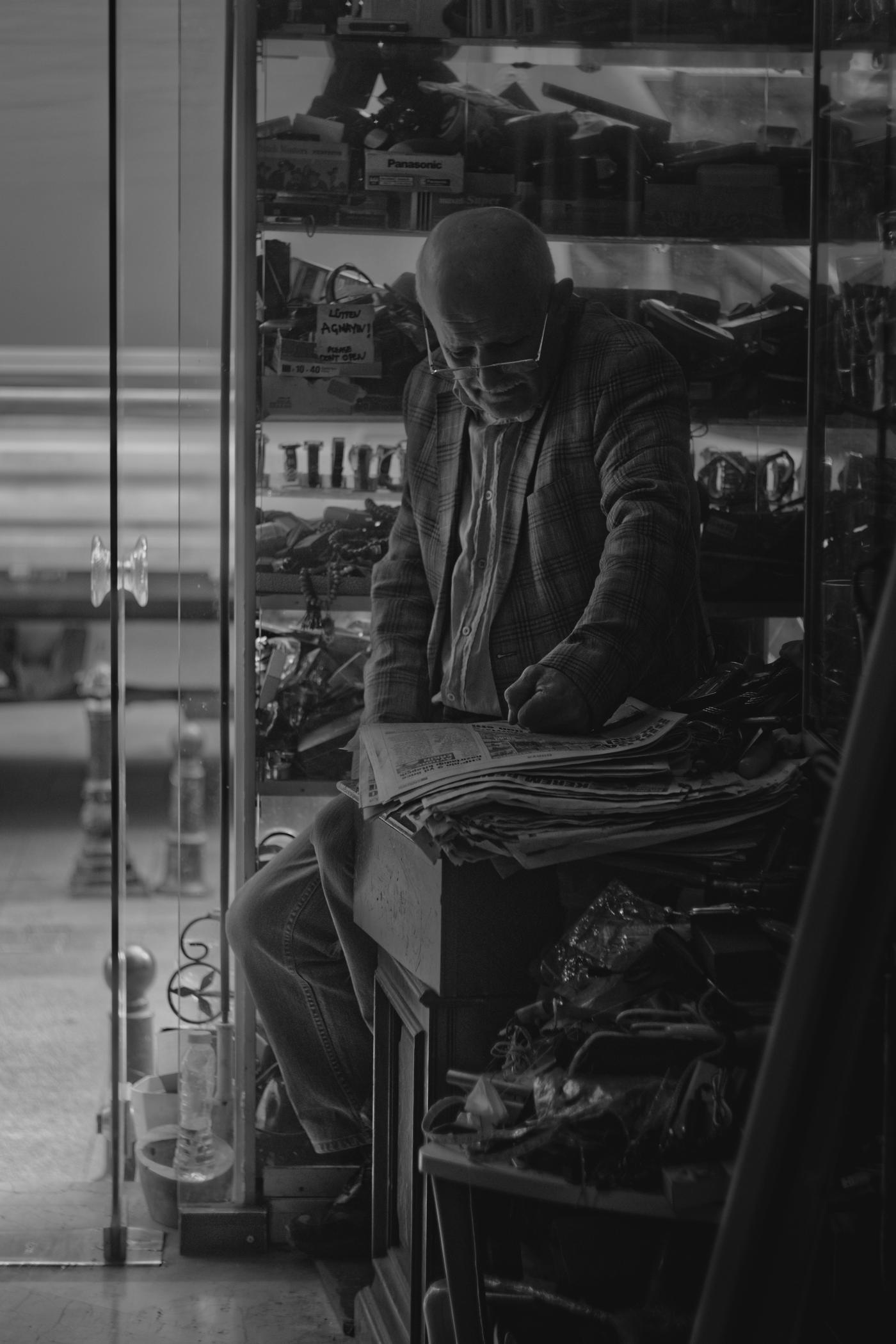 The smartly dressed owner of a junk store in Kadıköy, Istanbul. Turkey.