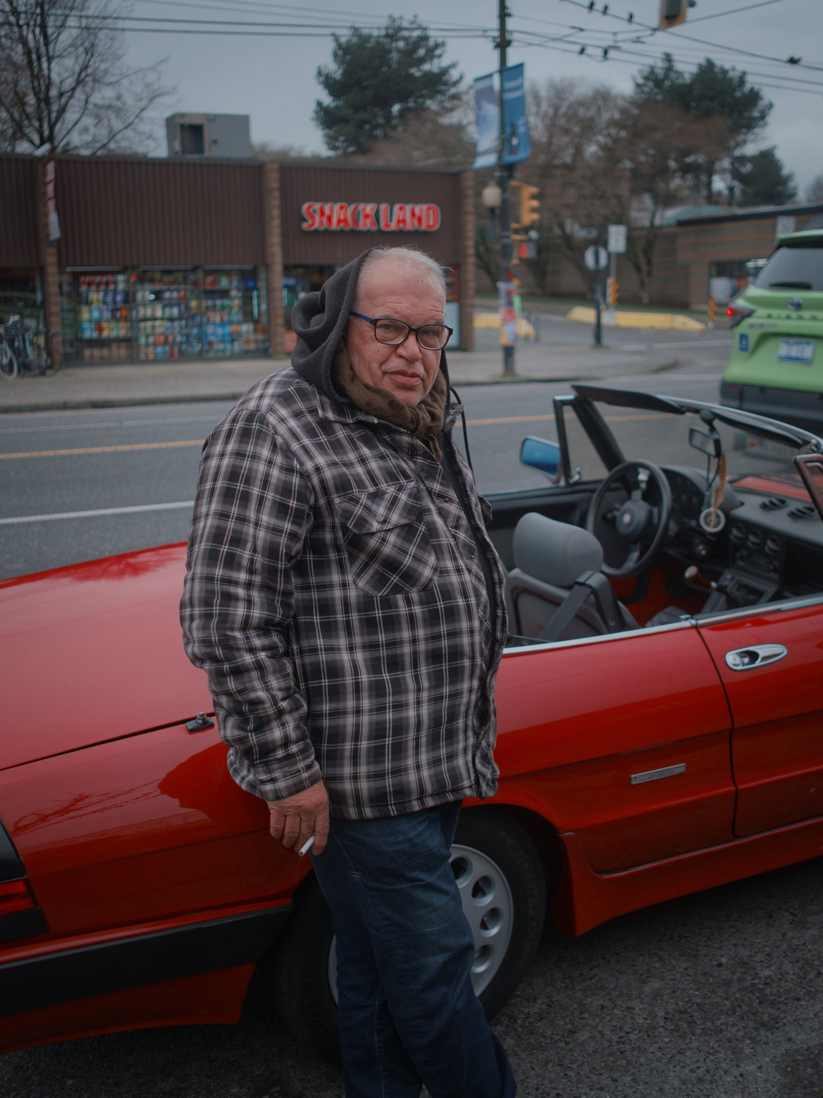 Elias, met on Main St, stood beside his beautiful Alfa Romeo. Vancouver