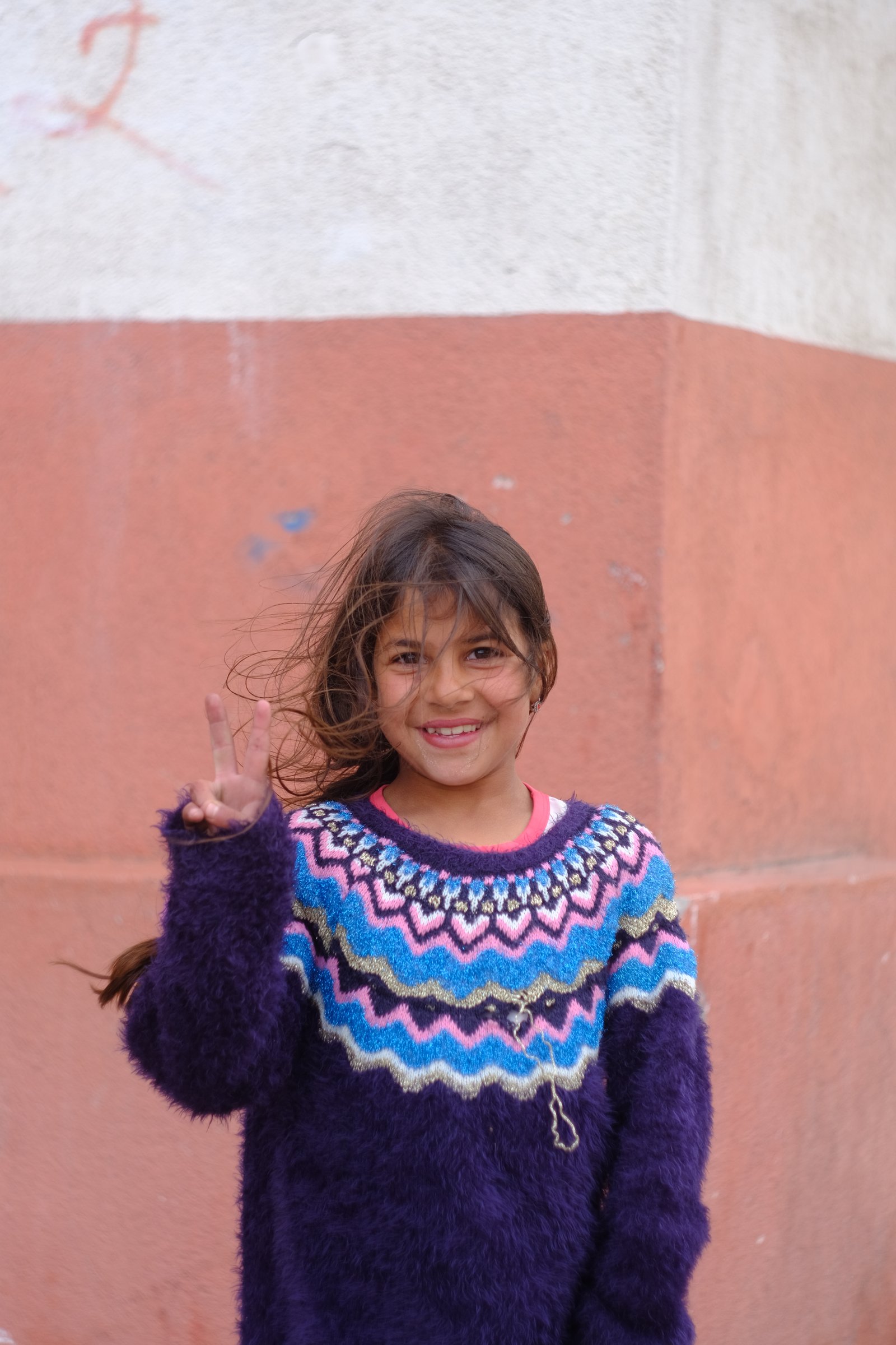 GĂĽnseli, met on my way out of the infinite sprawl of Istanbul, makes the peace sign as she poses for a photo. Turkey