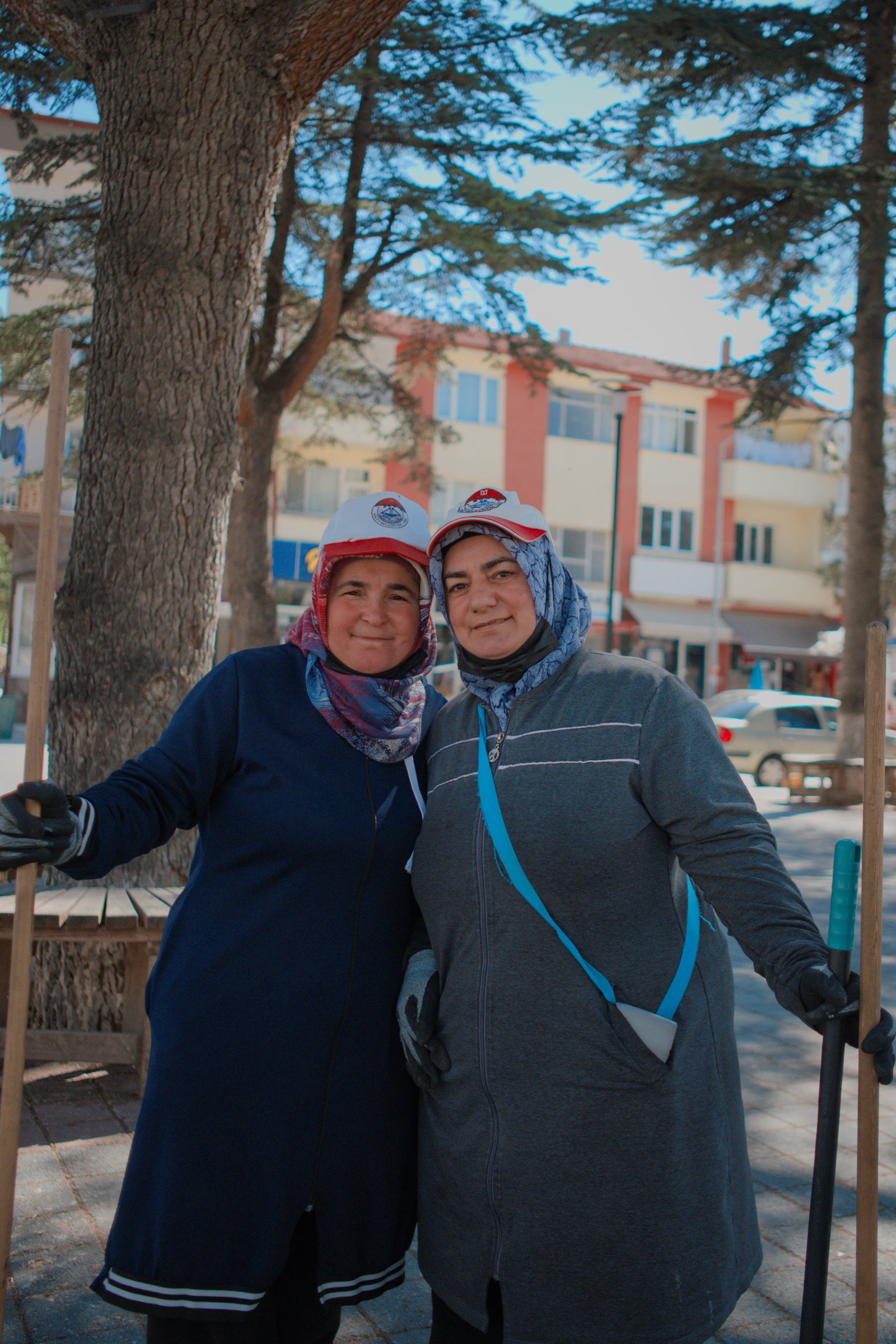 Ayhan and Asel, a cheerful pair to be found sweeping the streets of Sogut in the early morning. Sogut, Turkey