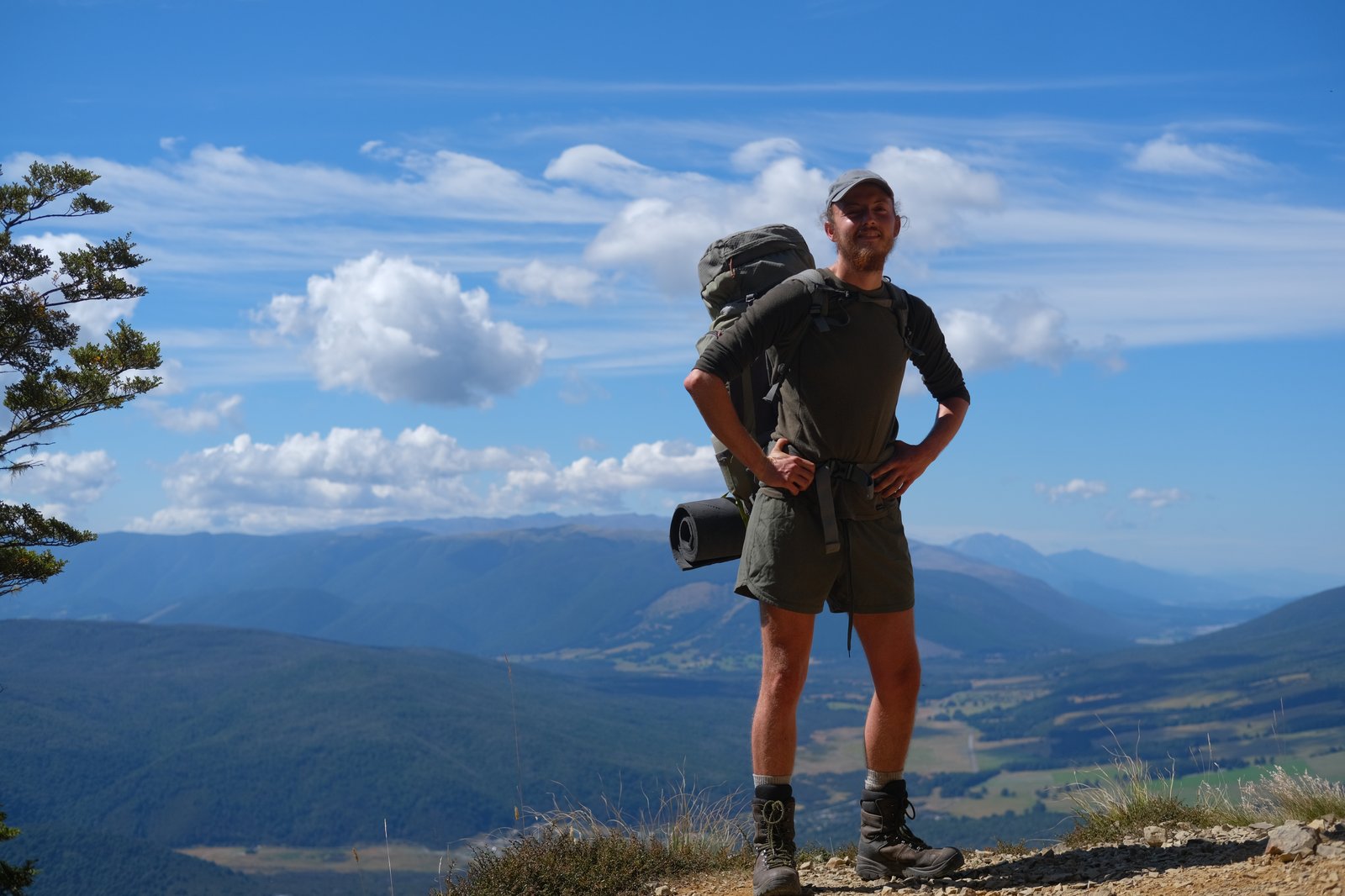 Me standing with a view of the Nelson Lakes region.