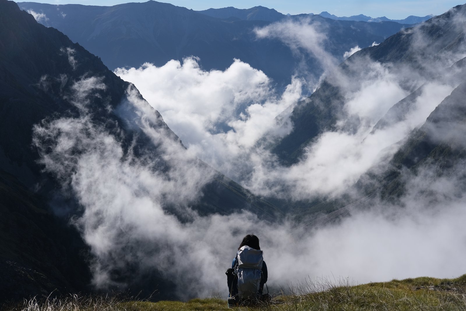 Mizuki sits looking out at the valley.