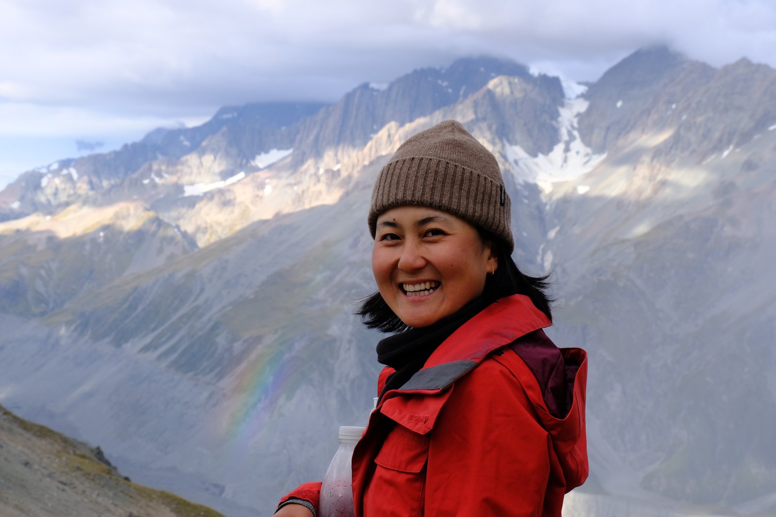 Mizuki in front of a rainbow above the Tasman Glacier, Aoraki National Park