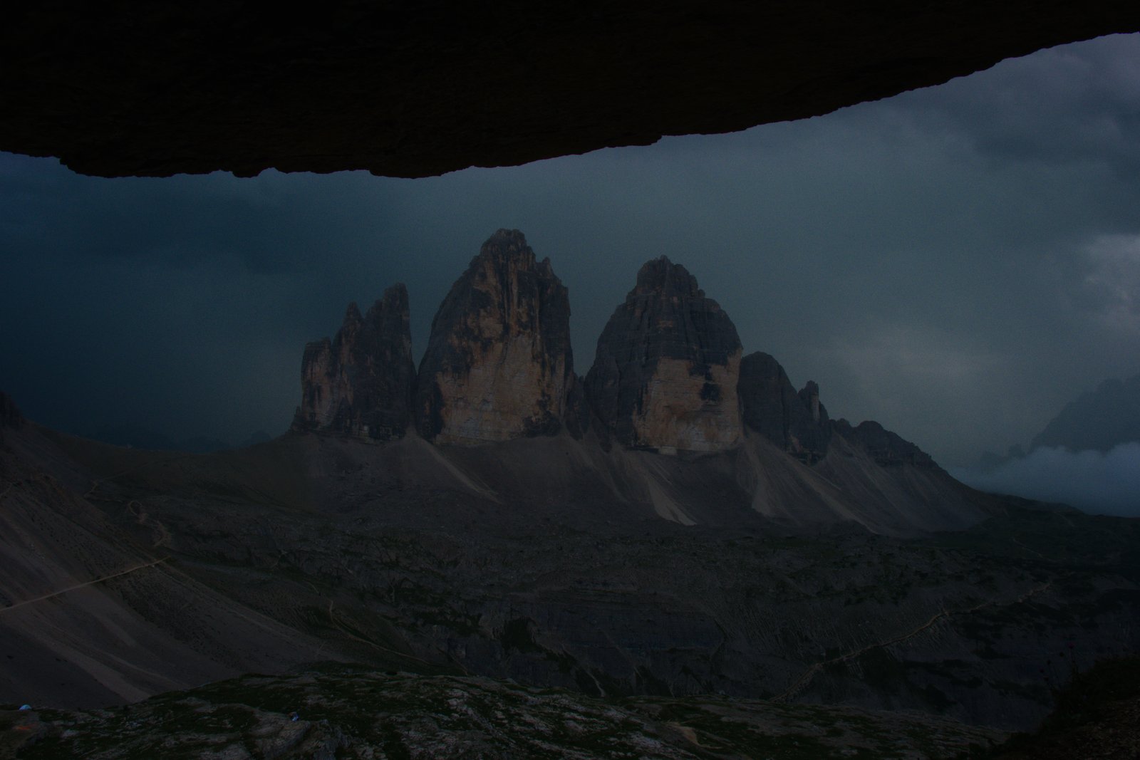 Looking across at Tre Cime do Lavaredo from a cave in Toblinger Knoten. Dolomites, Italy