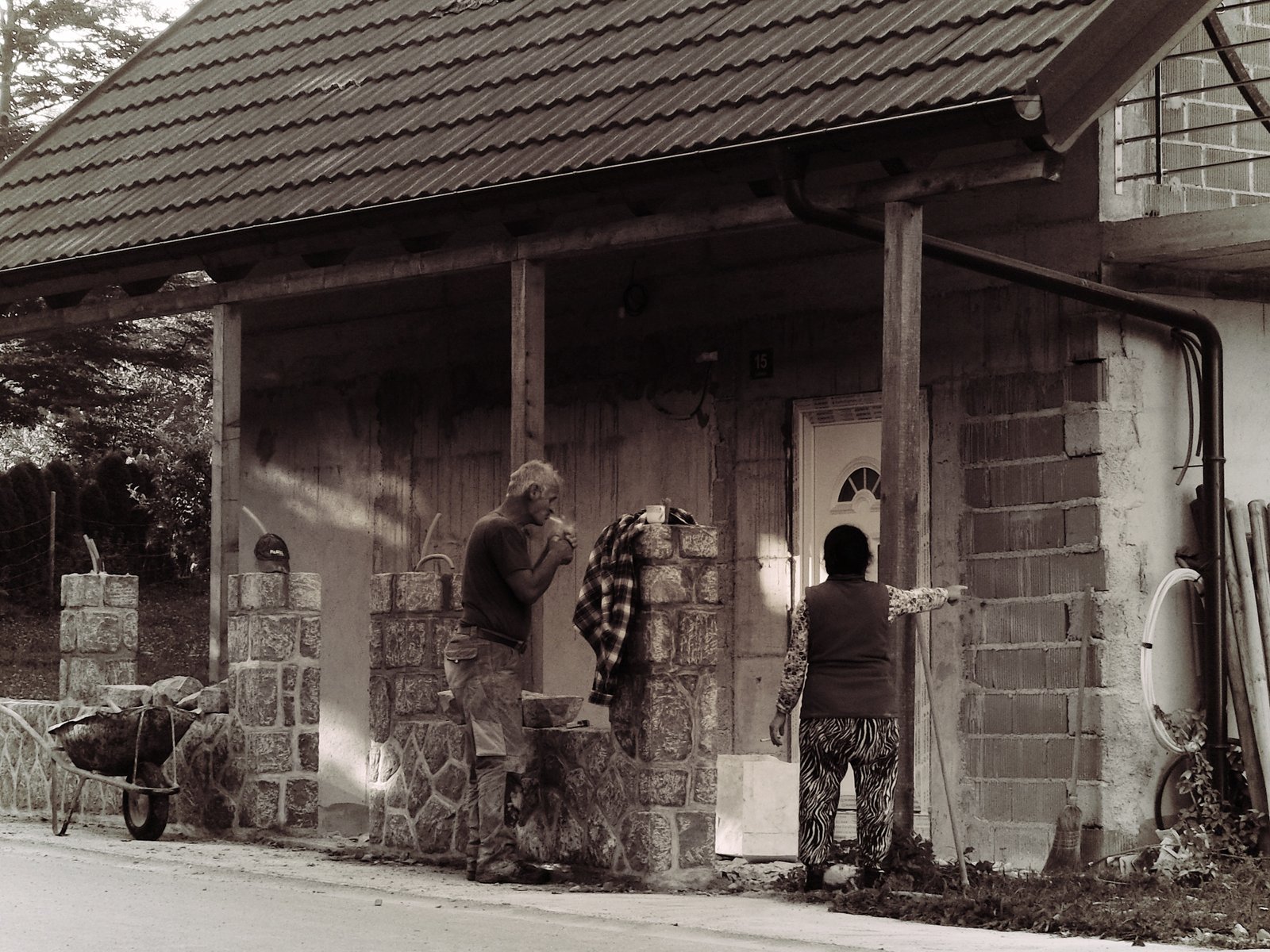 A warring husband and wife team disagreeing over the work to be done. The husband lights a cigarette and takes a deep drag before raising the decibels enough to end the discussion. Slovenia