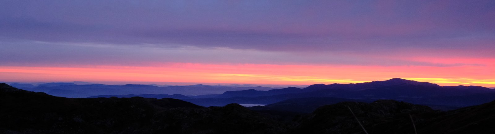 A view of the sunrise splitting the sky from our camp below the summit of Vileki Maglic, Montenegro