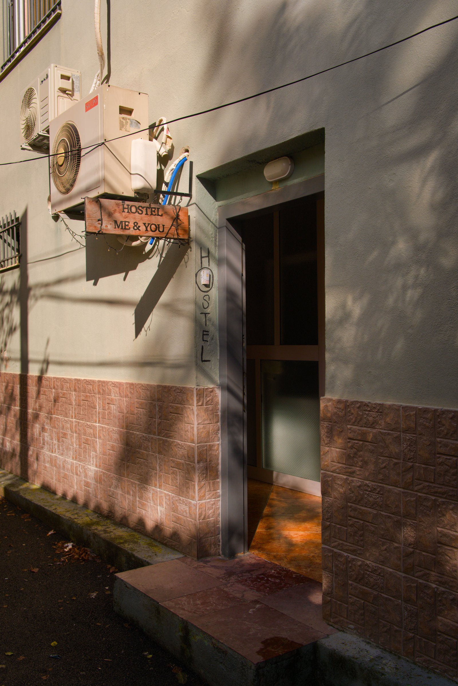 Down an alleyway, a door leads to a hostel where Mizuki and I would spend the night. Tirana, Albania