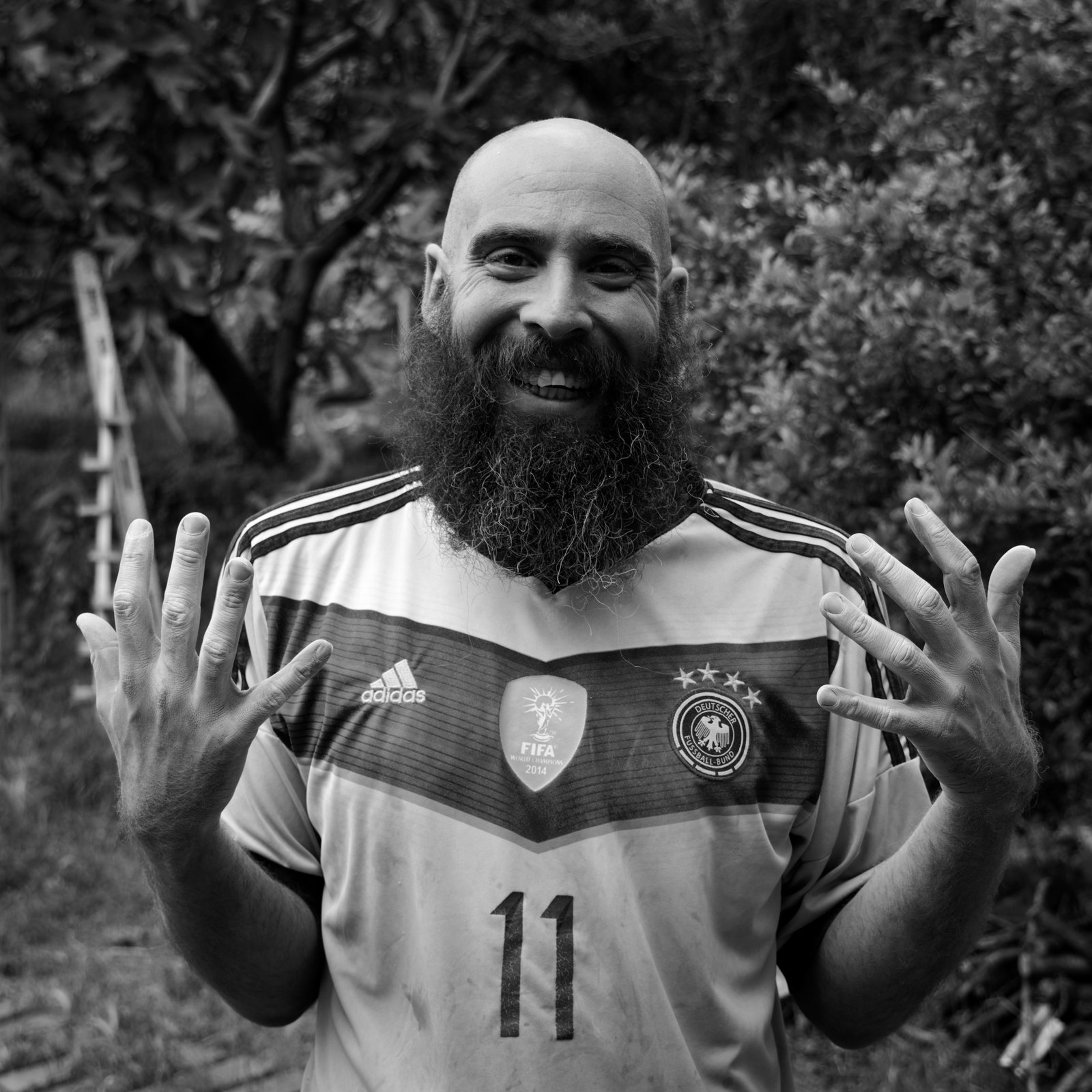 Atlas, smiling and covered in cement powder, though you can't see it in black and white. Pëllumbas, Albania