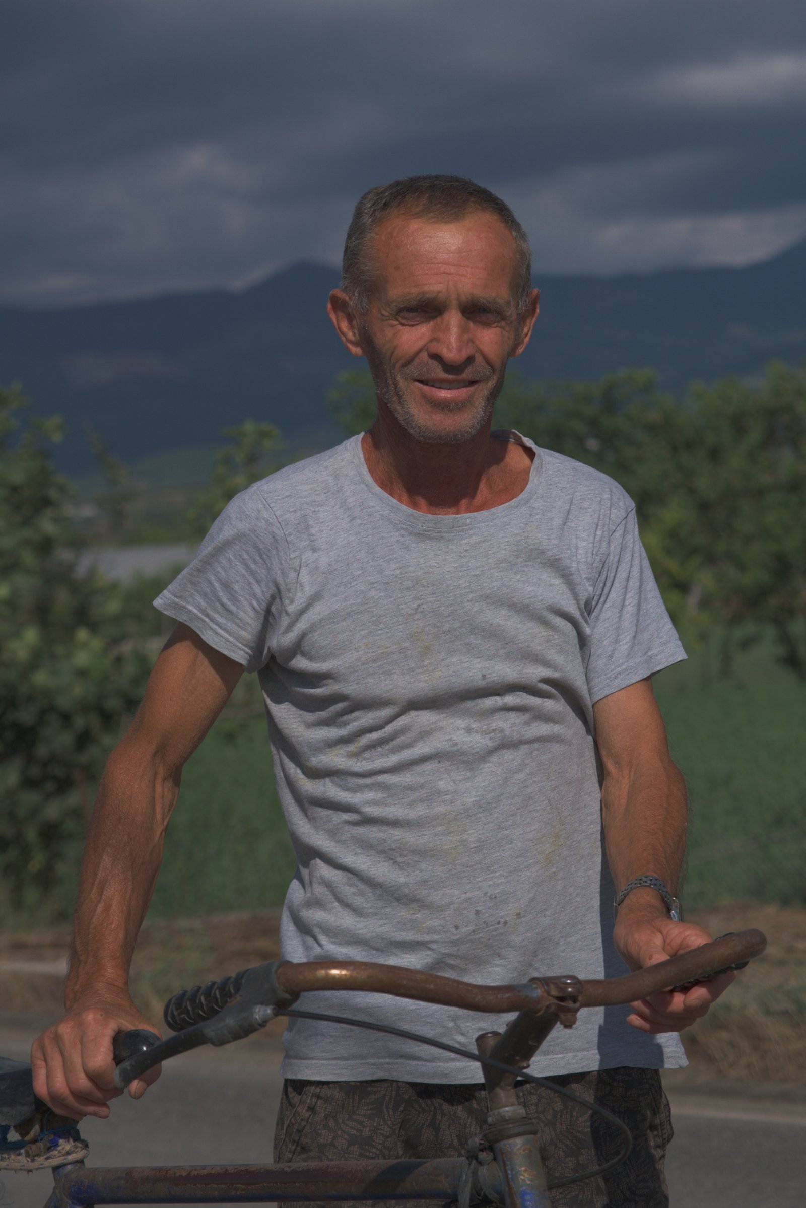 Mossa and I got to talking as he cycled home from his fields. Albania