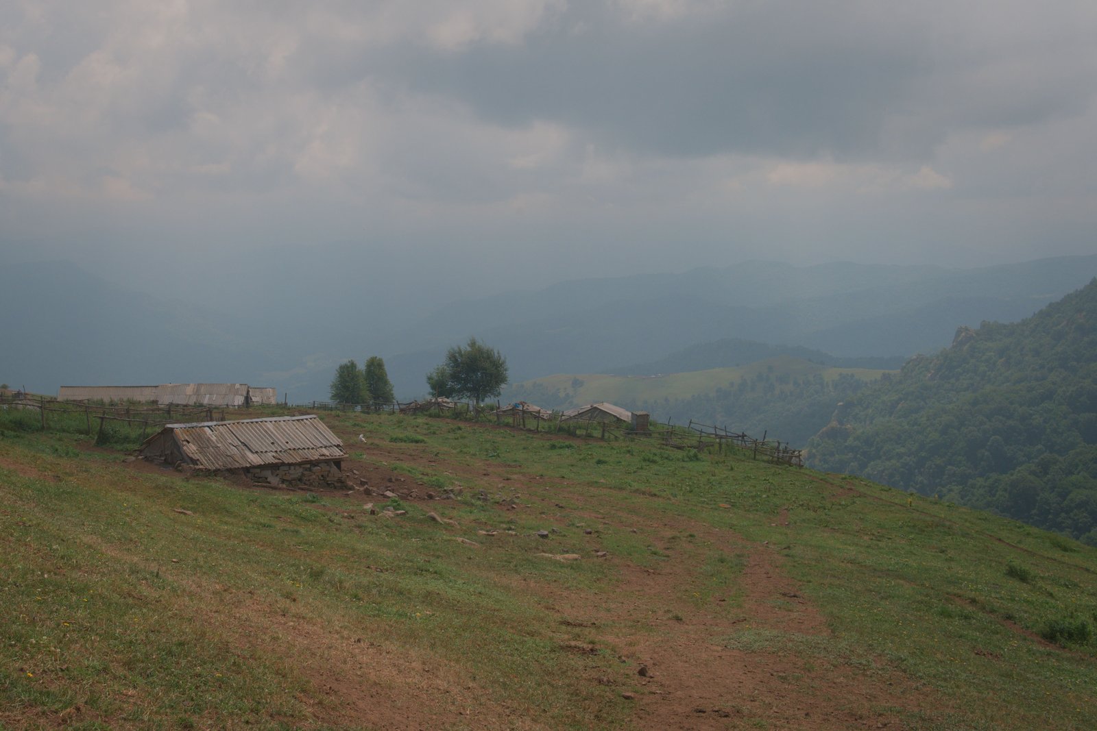 Looking out over a small collection of buildings, up high in the mountains beyond Alaverdi, Armenia