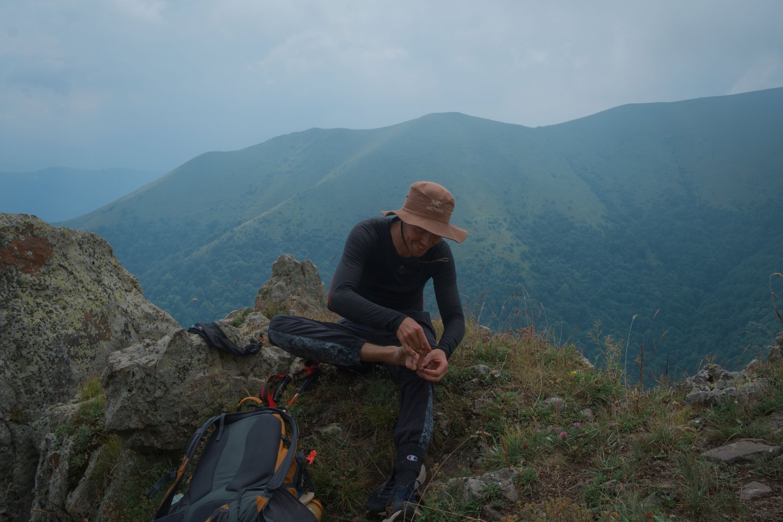Jonny tends to blistering feet in the mountains of Armenia