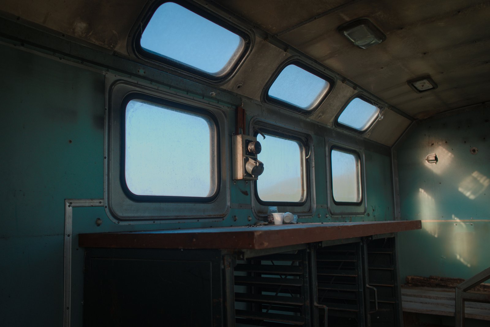 Looking out through the cupola-like windows of an abandoned Soviet trailer that was welcome shelter for Jonny and I during our trek through the mountains of Armenia
