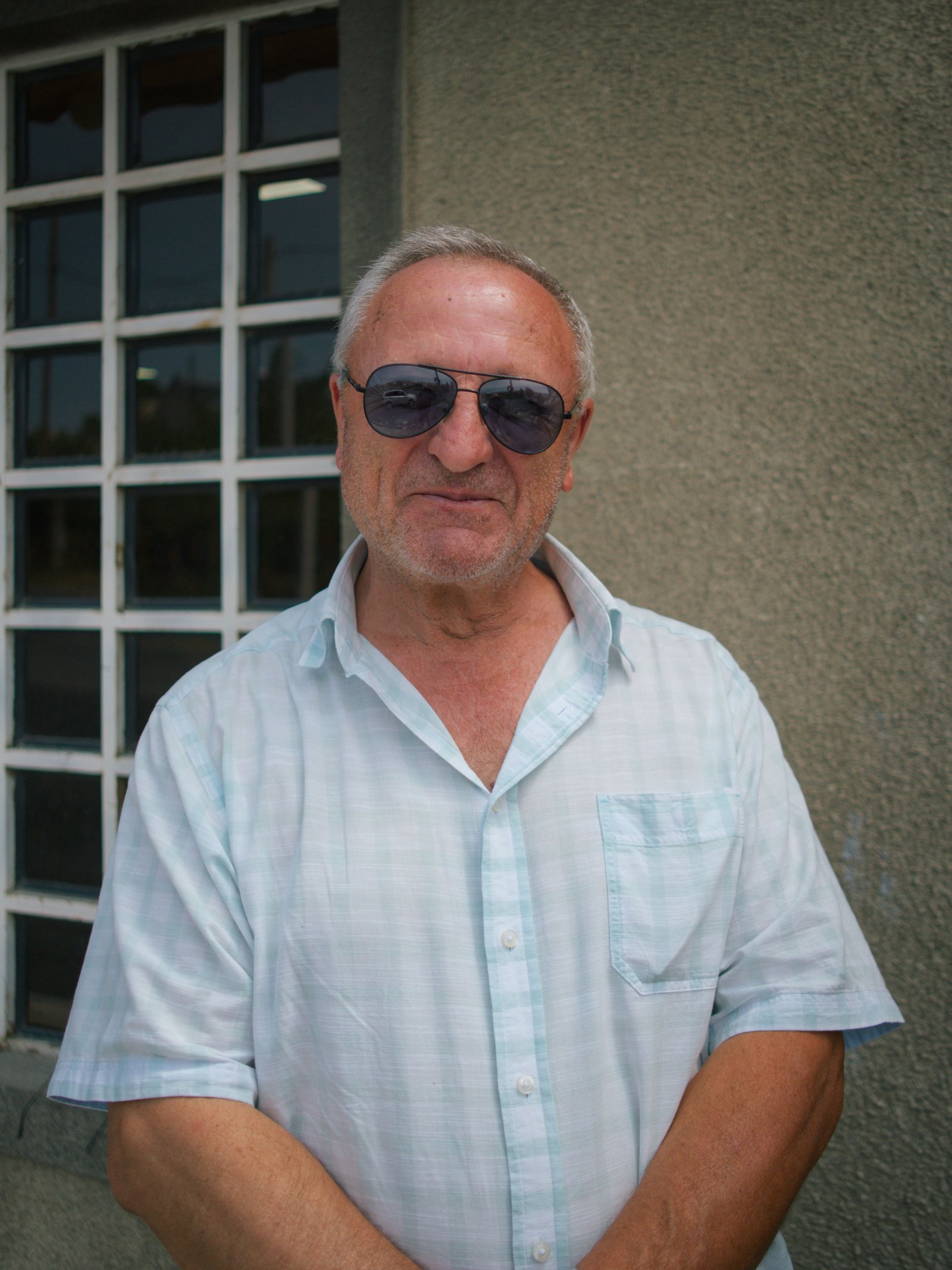 Hamayek smiles after asking me to take his portrait on the edge of Tsovagyugh, Armenia