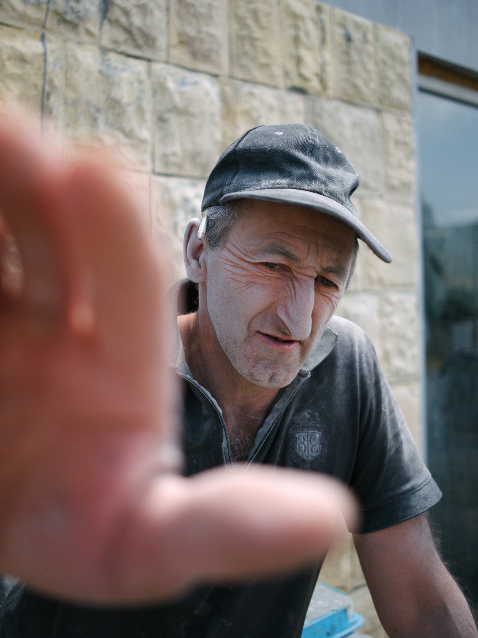 Daniel protests as I steal of a photo of him, his features put into striking relief by a layer of plaster dust across his face. Tsovagyugh, Armenia