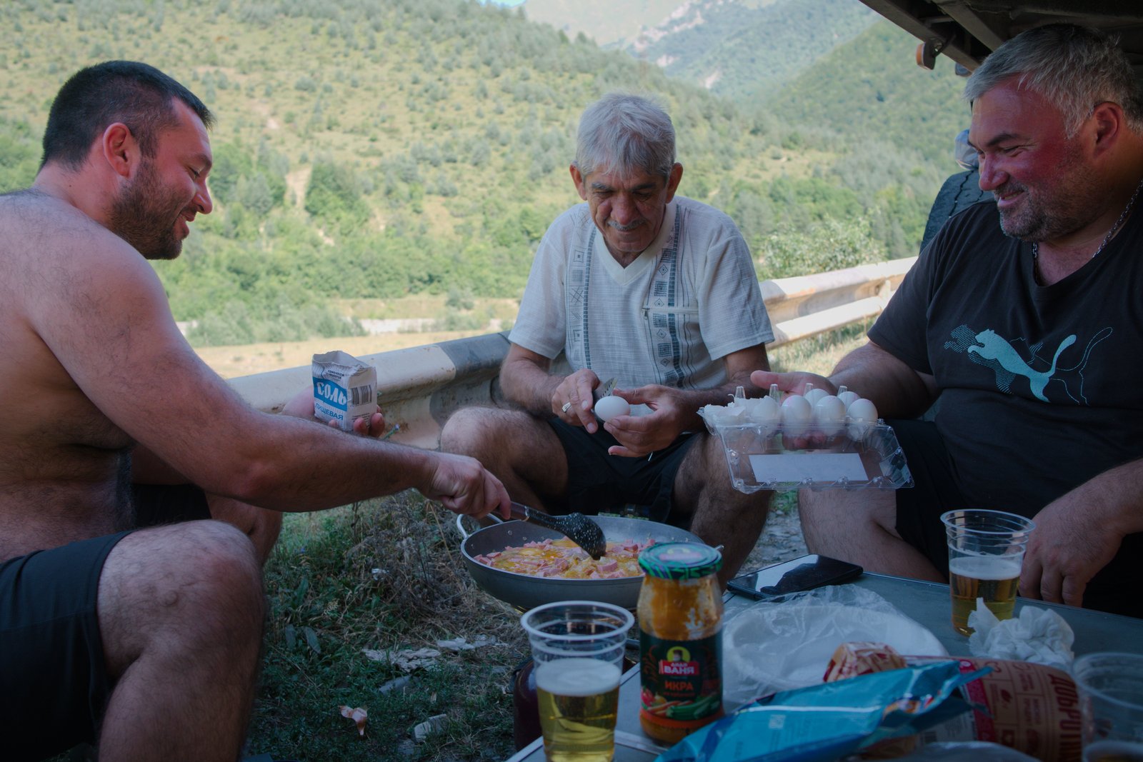Adam, Robert, and Robert take care of the cooking, while Hetag disappeared off in search of more beer.