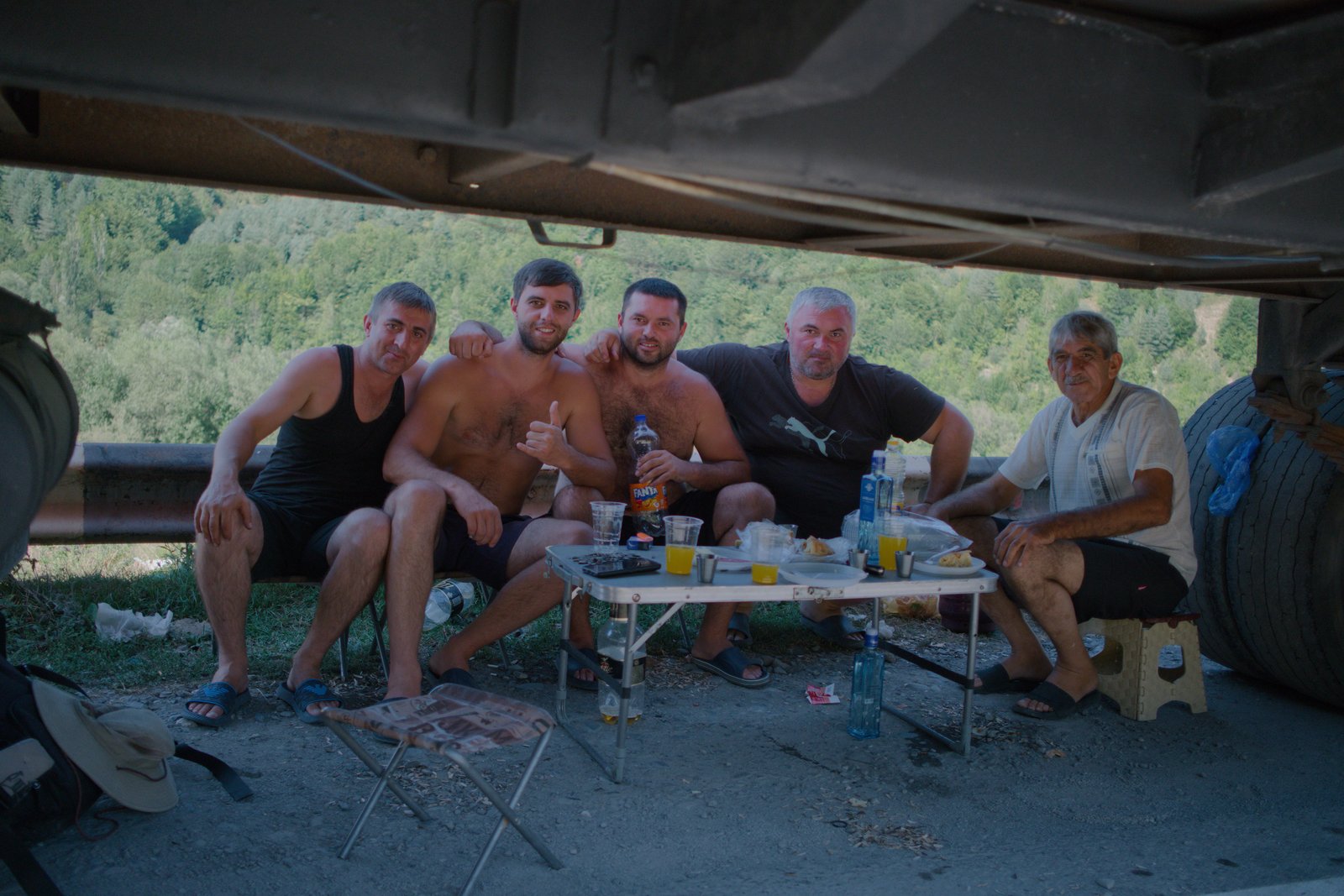 Hetag, Hetag, Adam, Robert, Robert. Five Ossetian truck drivers who share three names shared their lunch with me in the shade of one of their trucks. They'd been more than a week waiting at the Georgian/Russian border.