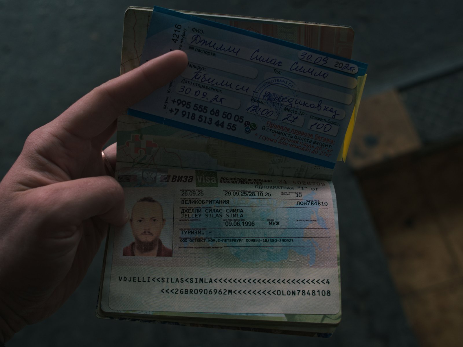 A redacted photograph of my long awaited visa allowing me to enter the Russian federation. Above, my coach ticket from Tbilisi back to the Russian border.