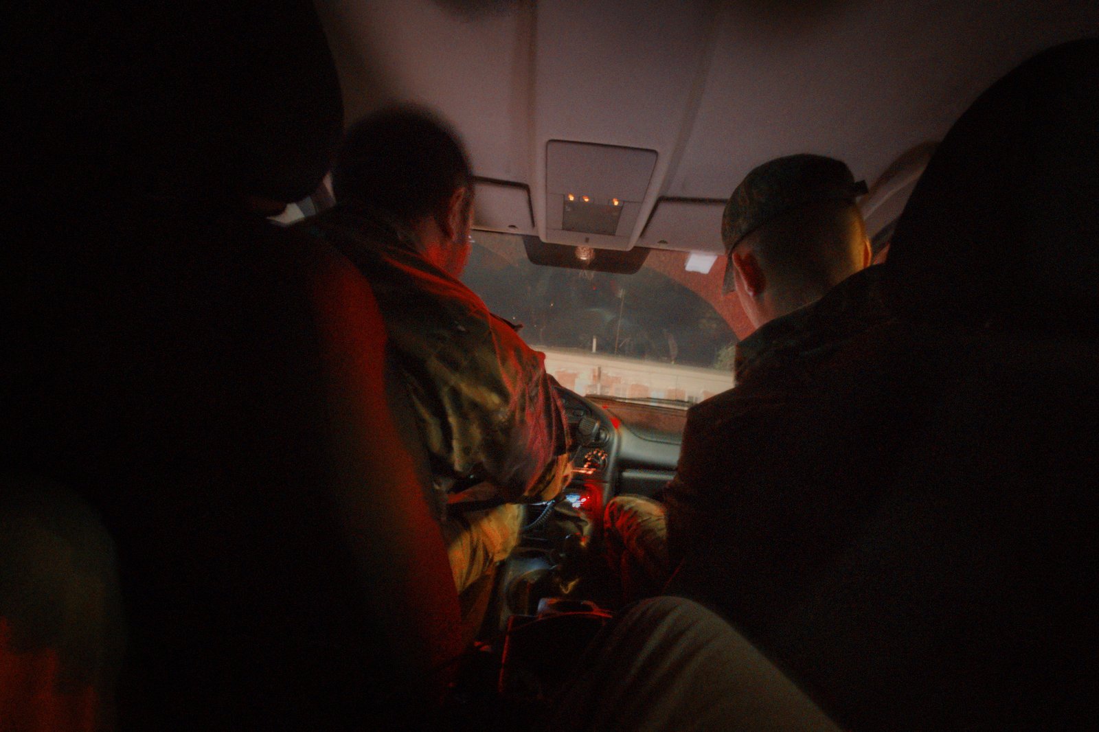 A sneaky snap of the two soldiers tasked with driving me back to Kizlyar after I was released from a border control compound on the edge of the Caspian sea. This was after we were out the "restricted zone" and I was allowed to climb up out of the footwell. Dagestan, Russia