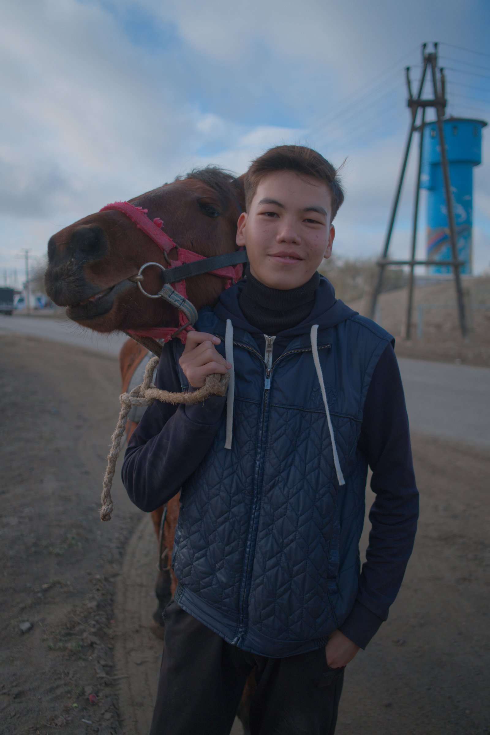 Daryn and his horse, who paused their mad gallop through the town to talk to the wanderer. Akkystau, Kazakhstan