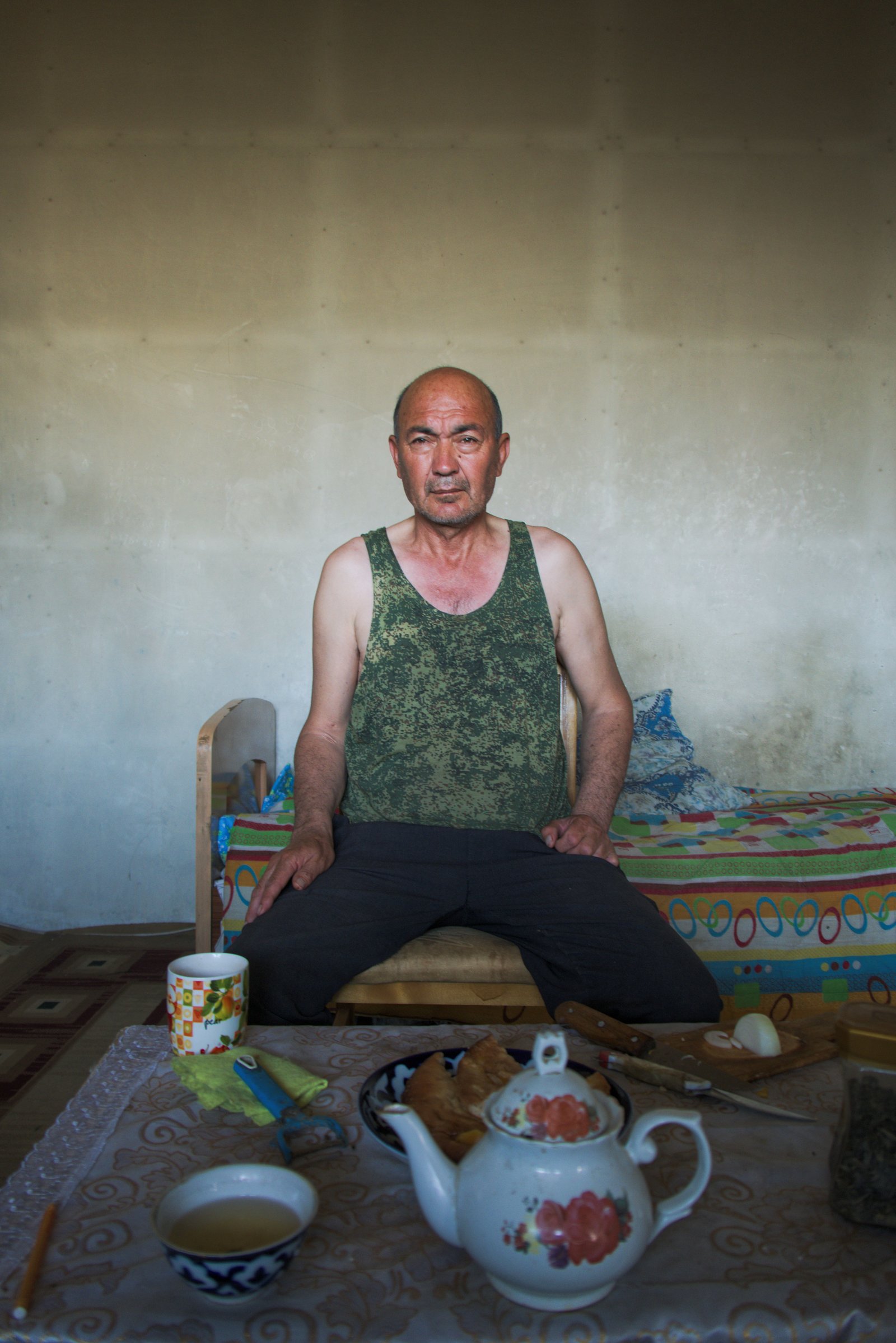 Umit, who inexplicably lived alone in the middle of nowhere with no car, but very kindly invited me in for chai and to cool off in the unrelenting heat of another desert day. Uzbekistan.