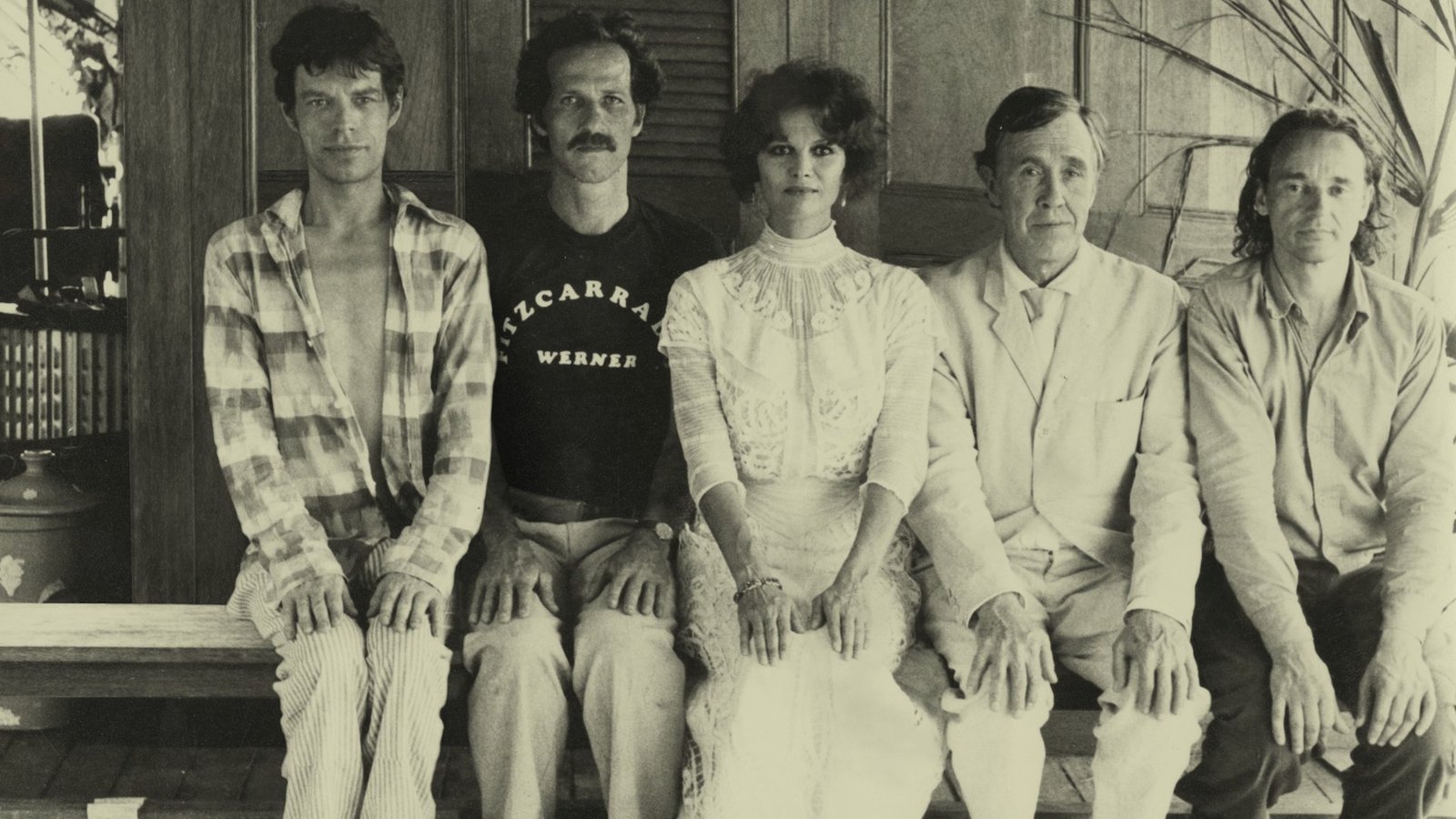 A photograph shows Mick Jagger, Werner Herzog, Claudia Cardinale, and Jason Robards on the set of the first filming of Fitzcarraldo