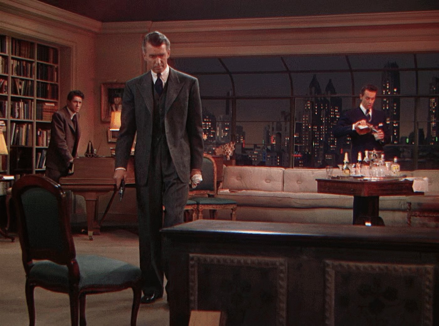 Rupert, Brandon, Phillip, and the chest in the closing scene of Rope (1948)